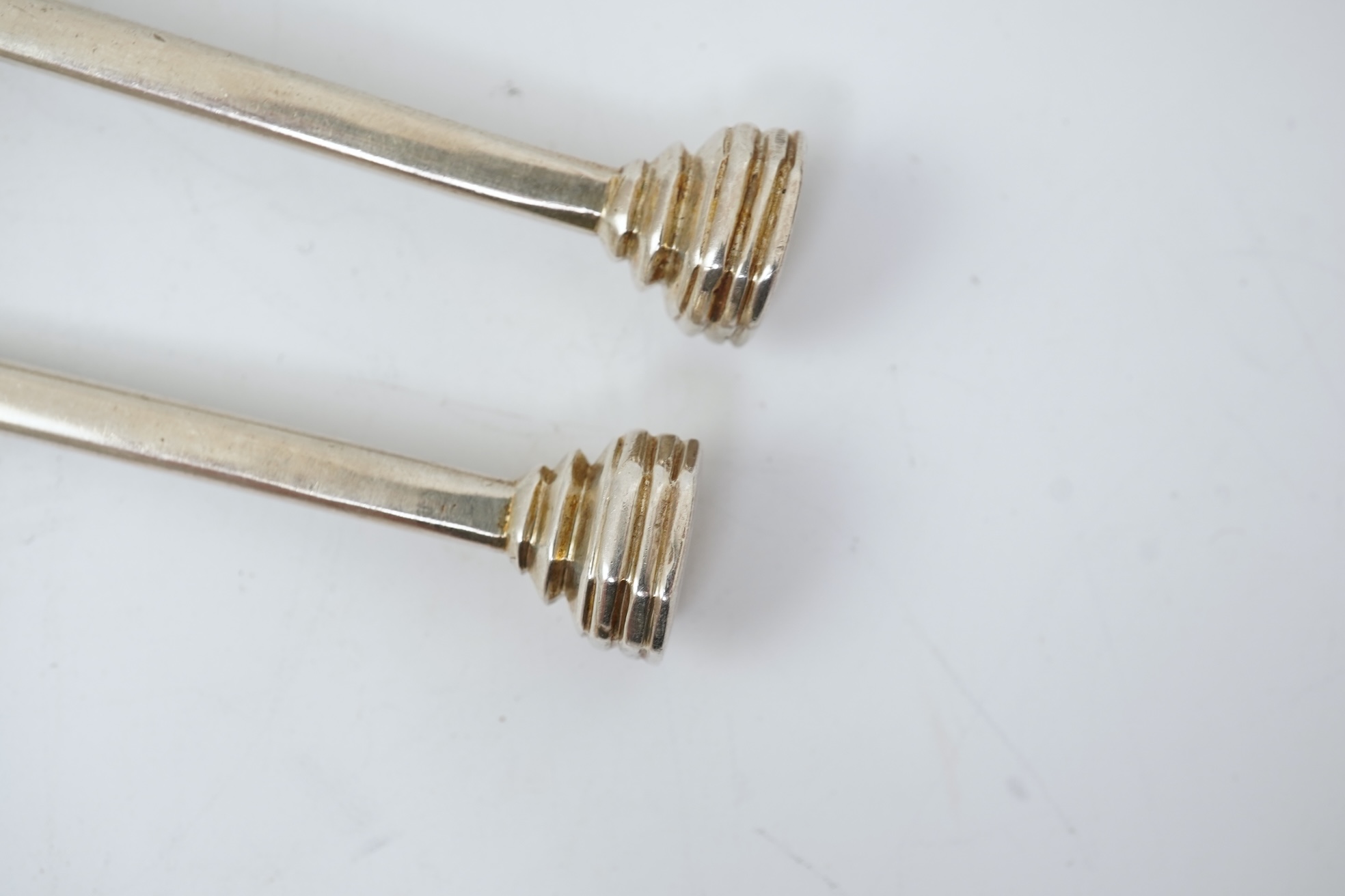 A pair of Elizabeth II silver 'seal top' spoons by The Guild of Handicrafts, London, 1990, 16cm, together with a similar later spoon, London, 2008 and a similar preserve spoon, London, 2003, two with boxes.